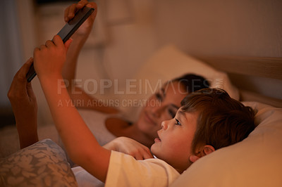 Buy stock photo Tablet, mother and son watch movie in bedroom together, digital and educational for learning of child. Parent, love and technology with connection to internet for bonding, mom and relax with boy