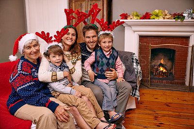 Buy stock photo Christmas, portrait and happy big family on sofa in home for holiday or festive celebration. Xmas, parents and smile of children with grandmother in living room, antlers or bonding together at party