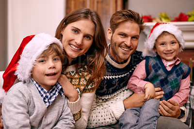 Buy stock photo Christmas, portrait and happy family in home for holiday or festive celebration in lounge. Xmas, parents and face of children with hats in living room, bonding and kids together at party in house