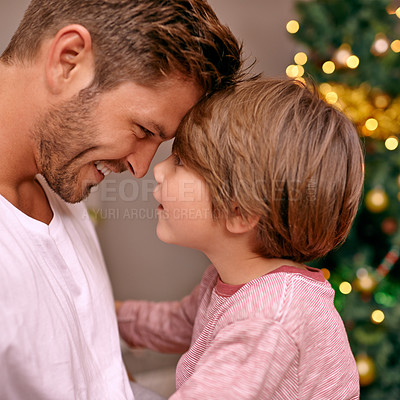 Buy stock photo Father, son and happy with bonding on christmas for celebration, playing and love in the morning with comfort. Family, man and child with smile, relax and enjoying holiday season in lounge of home