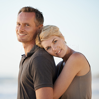 Buy stock photo Couple, hug and portrait on beach or holiday relax in California for marriage vacation, together or summer. Man, woman and face for date in paradise for stress relief or outdoor, calm or relationship