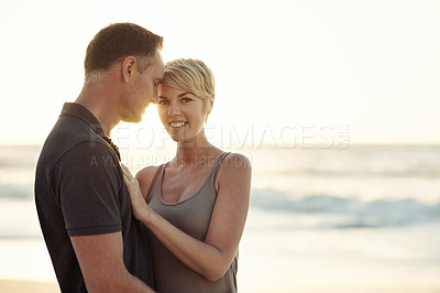 Buy stock photo Shot of a mature couple enjoying a day at the beach