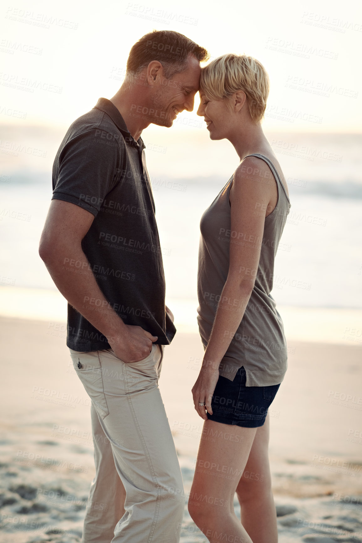 Buy stock photo Couple, love and smile on beach with bonding for honeymoon date and weekend holiday in Seychelles. Relax, man and woman with relationship, happy and care on sea sand for vacation, travel or adventure