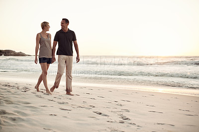 Buy stock photo Couple, walking and beach relax for holiday connection in California or marriage commitment, bonding or travel. Man, woman and explore tropical island at sunset or paradise honeymoon, date or seaside