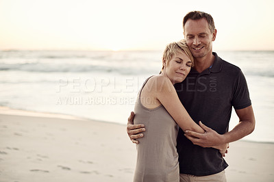 Buy stock photo Couple, face and happy on beach with hug for bonding, honeymoon date and weekend holiday in Turkey. Relax, man and woman with embrace, smile and love on sand by sea for vacation, travel and adventure