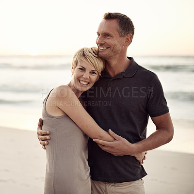 Buy stock photo Couple, portrait and happy on beach with hug for bonding, honeymoon date and weekend holiday in California. Face, man and woman with embrace, smile and love by sea for vacation, travel and adventure