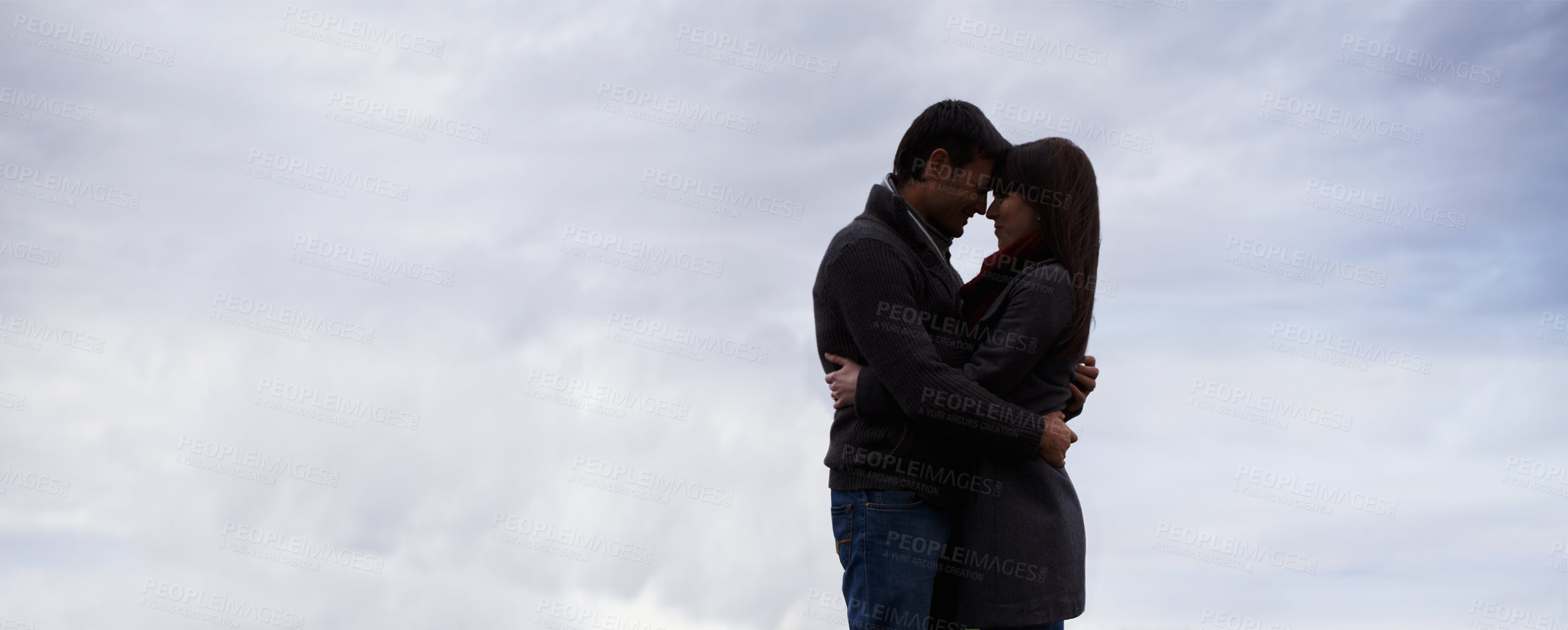 Buy stock photo Couple, sky and hug together with love for romance, commitment and care for feeling safe. Man, woman and relationship with mockup, space and banner outdoors on honeymoon with spouse comfort and trust