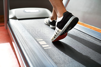 Buy stock photo Closeup shot of a man on a treadmill at the gym