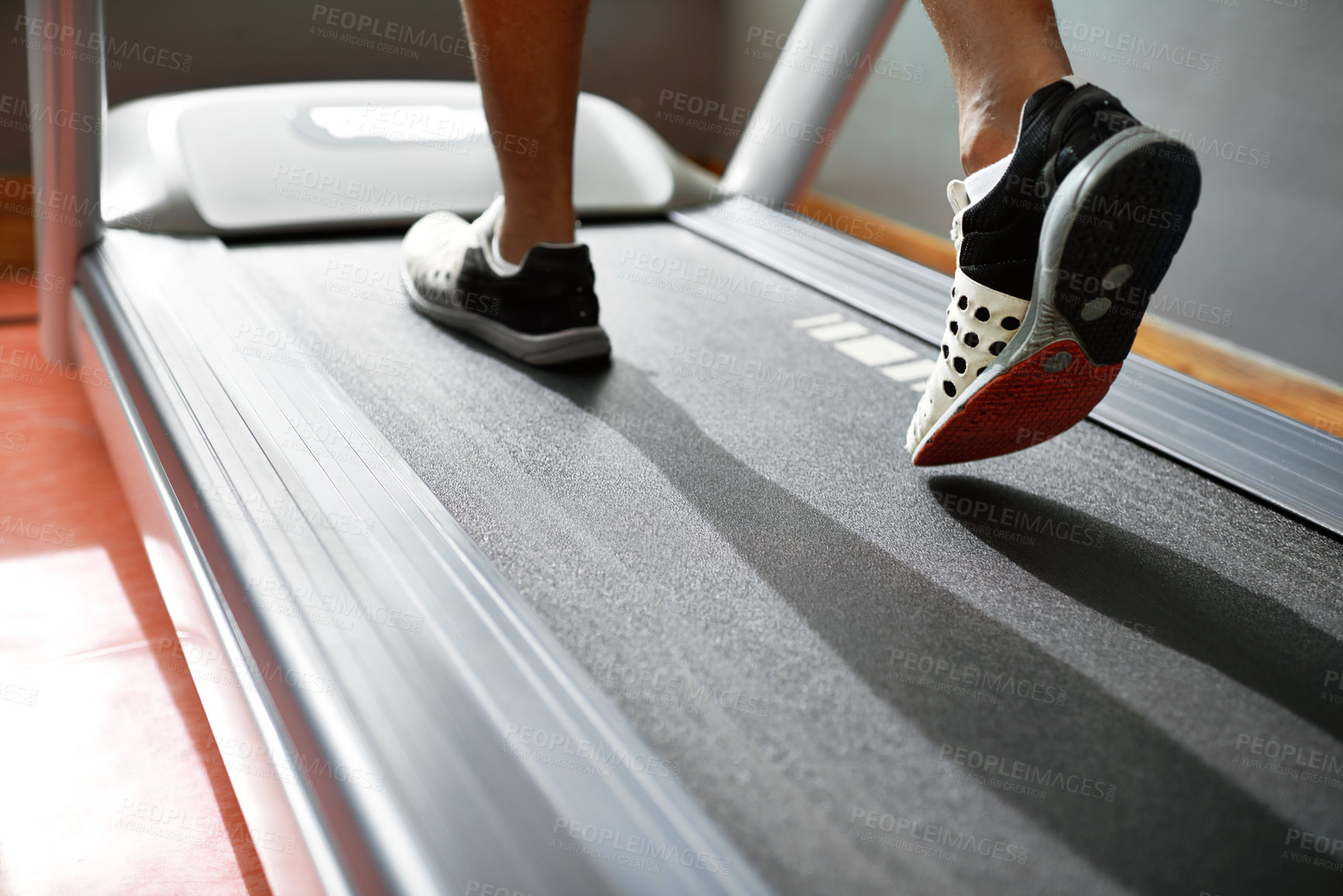 Buy stock photo Fitness, feet and person running on treadmill in gym for health, wellness and body training. Active, shoes and closeup of athlete with workout or exercise on cardio machine at sports center.