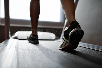 Buy stock photo Sports, feet and person running on treadmill in gym for health, wellness and body training. Active, shoes and closeup of athlete with workout or exercise on cardio machine at fitness center.