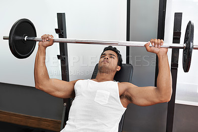 Buy stock photo Bench, press and exercise at gym with man in workout for body building in Mexico. Healthy, person and weightlifting challenge for strong muscle, fitness or progress in training with barbell in club