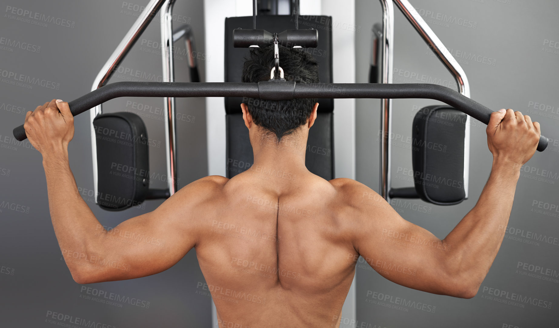 Buy stock photo Exercise, pull down machine and man in studio on gray background for training or workout at gym. Back, health or shoulder press and body builder with equipment for wellness, strength or power