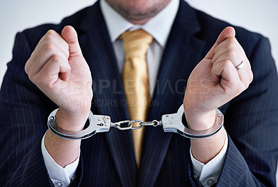 Buy stock photo Hands, person in corporate and handcuffs for fraud or bribery, business deal gone wrong with justice or jail. Professional crime, corruption or money laundering, shackles for prison with criminal