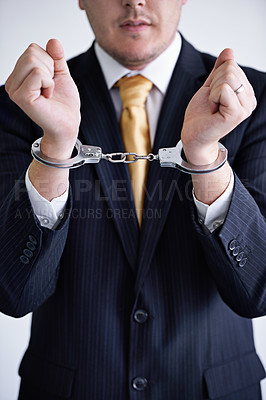 Buy stock photo Hands, business man and handcuffs for fraud or bribery, suspicious professional deal with justice or jail. Crime, corruption or money laundering, shackles for prison with thief or criminal in finance