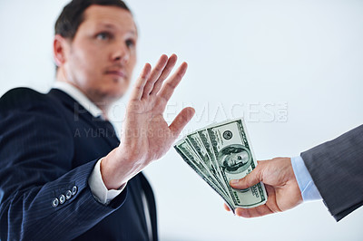 Buy stock photo Businessman, hands and rejection with money for bribe, payment or fraud on a white studio background. Man or employee saying no to cash, dollar bills or paper for scam, secret or bribery on mockup