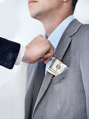 Buy stock photo Businessman, hands and bribe with money for fraud, payment or deal on a white studio background. Closeup of man or employee taking cash, dollar bill or paper in scam, secret or bribery from colleague