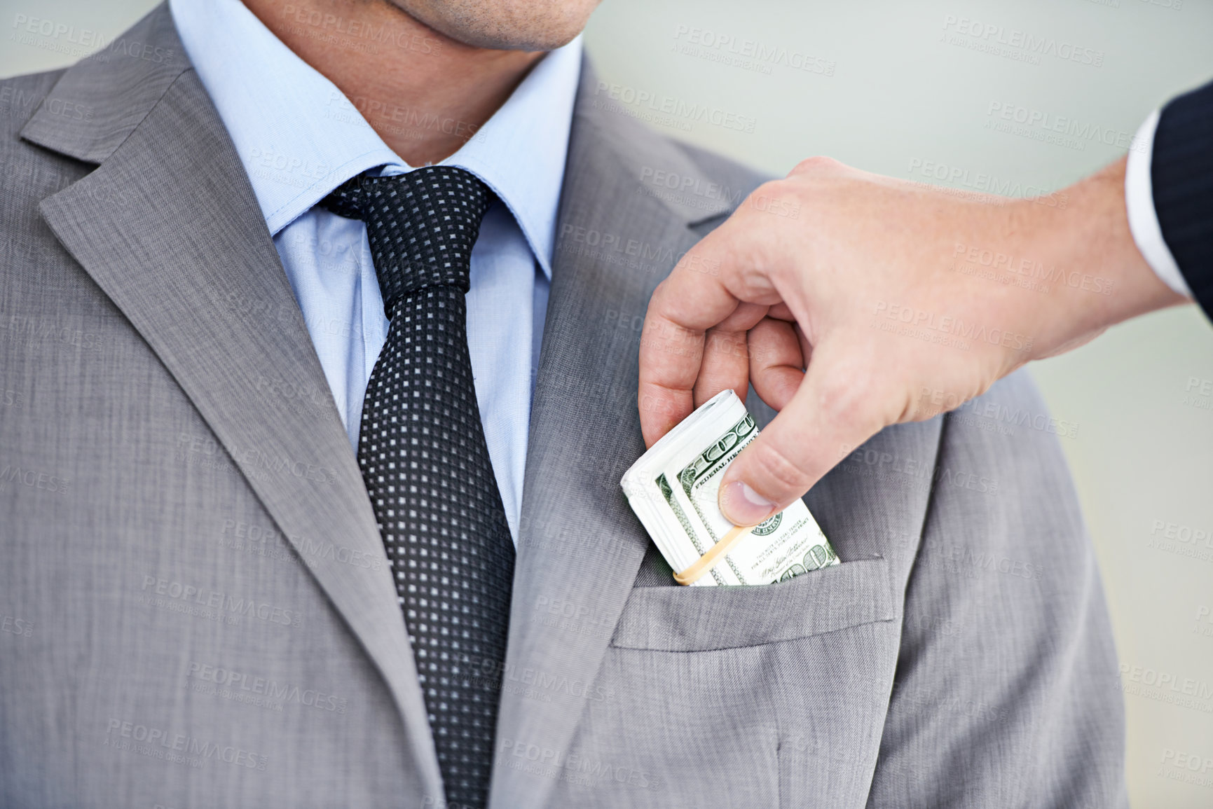 Buy stock photo Businessman, hands and bribe with cash for fraud, payment or deal on a white studio background. Closeup of man or employee taking money, dollar bill or paper in scam, secret or bribery from colleague