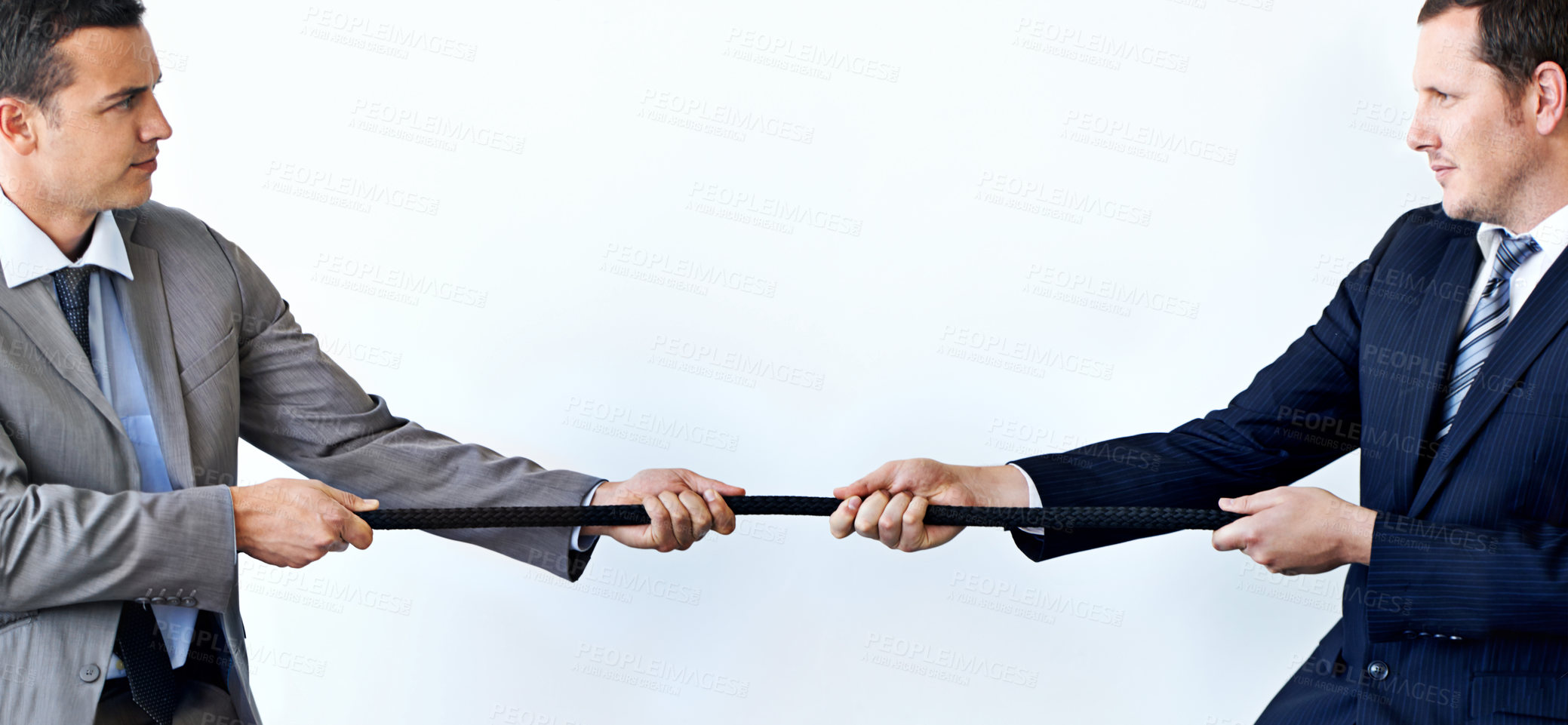 Buy stock photo Businessman, rope and tug of war for challenge, mission or strength of rivals on a blue studio background. Man, business employees or colleagues hands pulling strong cable for competition on mockup