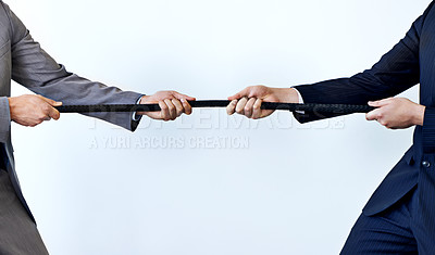 Buy stock photo Business people, rope and tug of war for challenge, mission or strength of rivals on a blue studio background. Closeup of employees or colleagues hands pulling strong cable for competition on mockup
