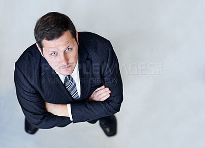 Buy stock photo Crossed arms, top view and serious businessman in office with positive, good and confident attitude. Portrait, professional and high angle of male lawyer with pride for legal career in workplace.