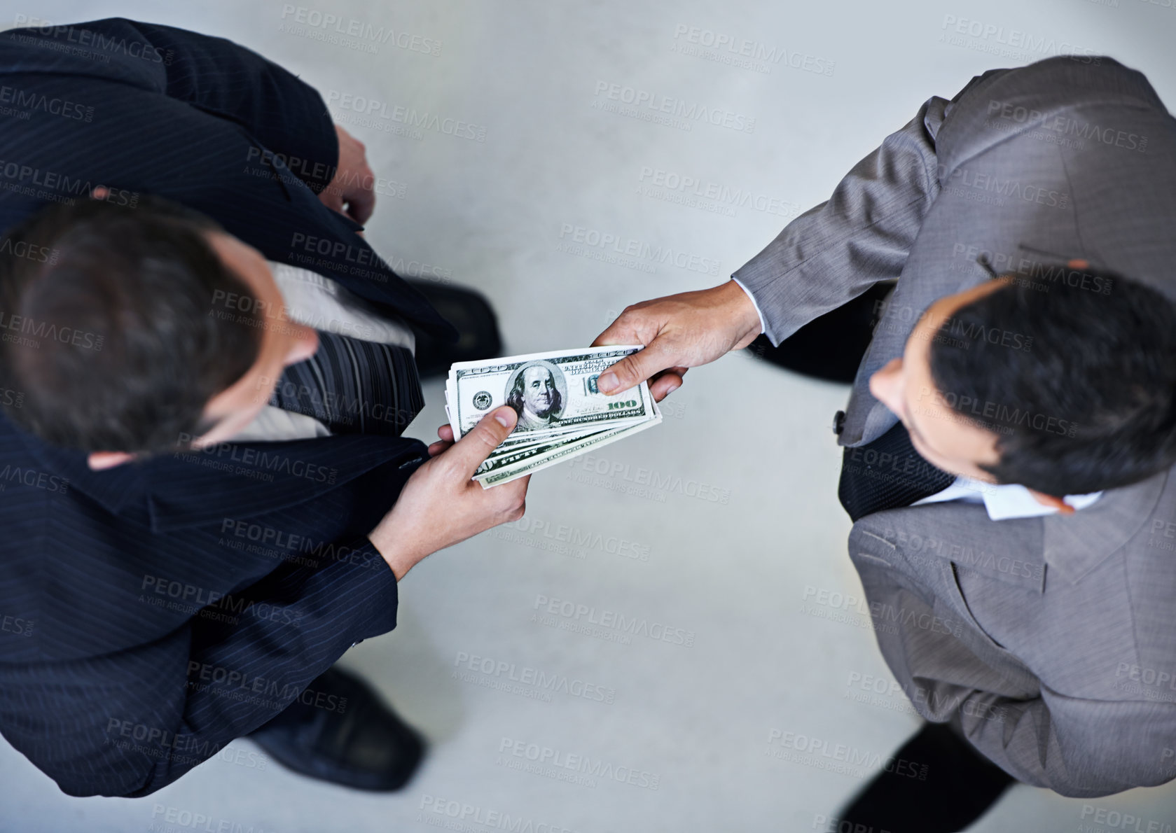 Buy stock photo Businessman, money and bribe above with dollar bills for payment, deal or agreement at office. Top view of man, colleagues or employees giving cash, paper or exchange in bribery, scam or fraud