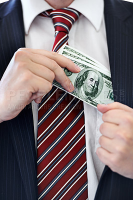 Buy stock photo Businessman, hands and money bribe in pocket for fraud, scam or secret on a white studio background. Closeup of employee with cash, dollar bills or finance in bribery, deal or financial exchange