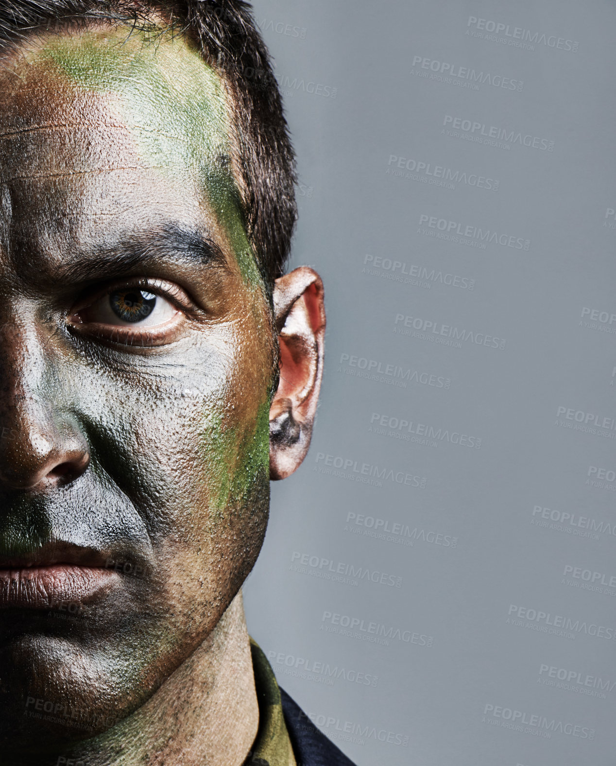 Buy stock photo Man, portrait and soldier with face paint for camouflage, military war or battle on a gray studio background. Closeup of male person, army or commander with color dye in undercover disguise on mockup