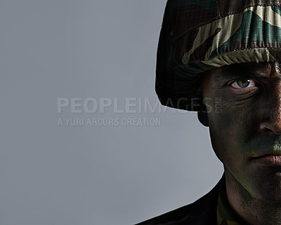 Buy stock photo Man, portrait and soldier with camouflage for army, military war or battle on a gray studio background. Closeup of male person or commander with face paint or helmet in undercover disguise on mockup
