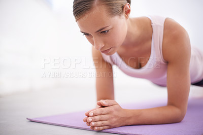 Buy stock photo An attractive young woman working out