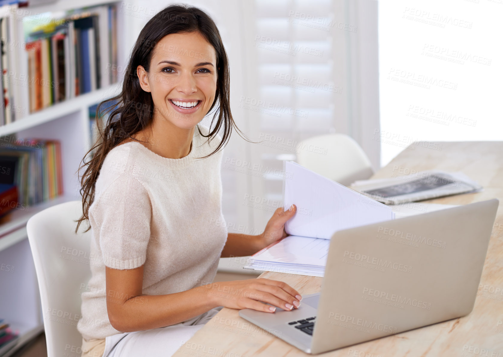 Buy stock photo Portrait of an attractive young woman using her laptop at home