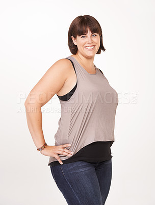 Buy stock photo Studio, portrait and plus size woman with confidence for casual fashion to relax in jeans for comfort. Female person, smile and positive with happiness as model in white background of backdrop

