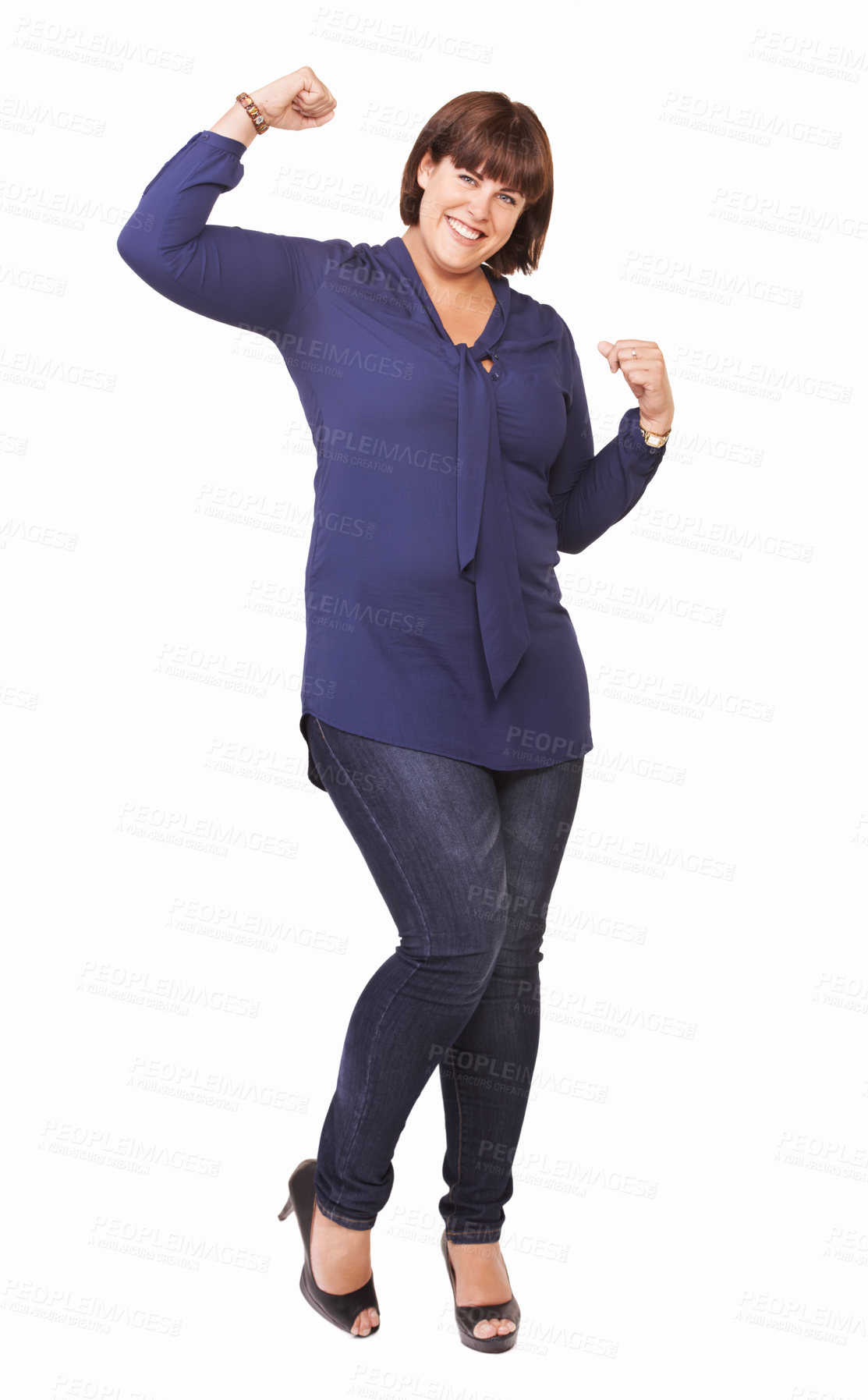 Buy stock photo Portrait of a pretty young woman with her arms raised in victory on a white background