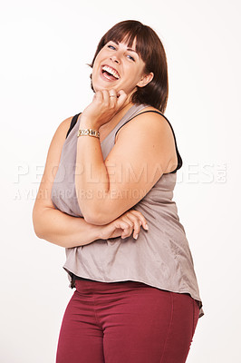 Buy stock photo Portrait of a happy young woman laughing on a white background
