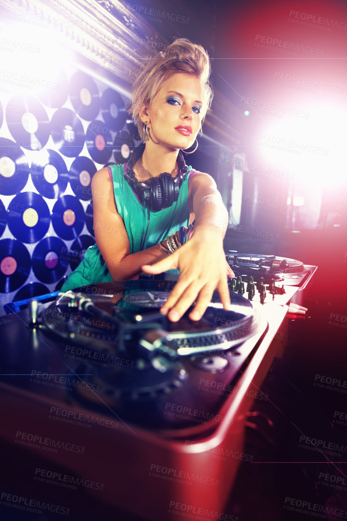 Buy stock photo Portrait, woman dj, and headphones with vinyl in night club with mixing decks and lens flare. Female person, turntable and hands for spinning, tracks and music with energy at disco in Berlin