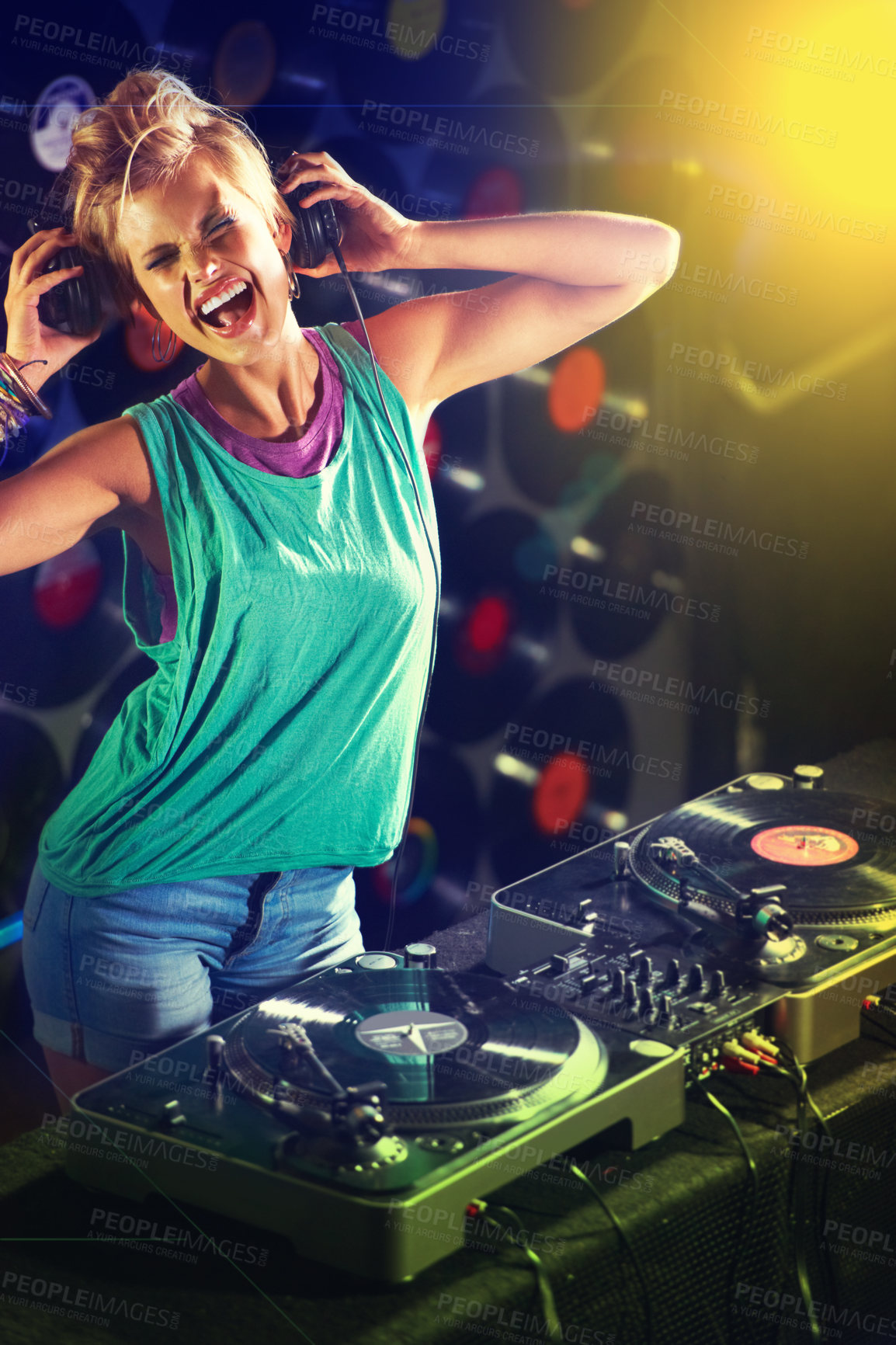 Buy stock photo A young female dj listening to some mixes on her headphones