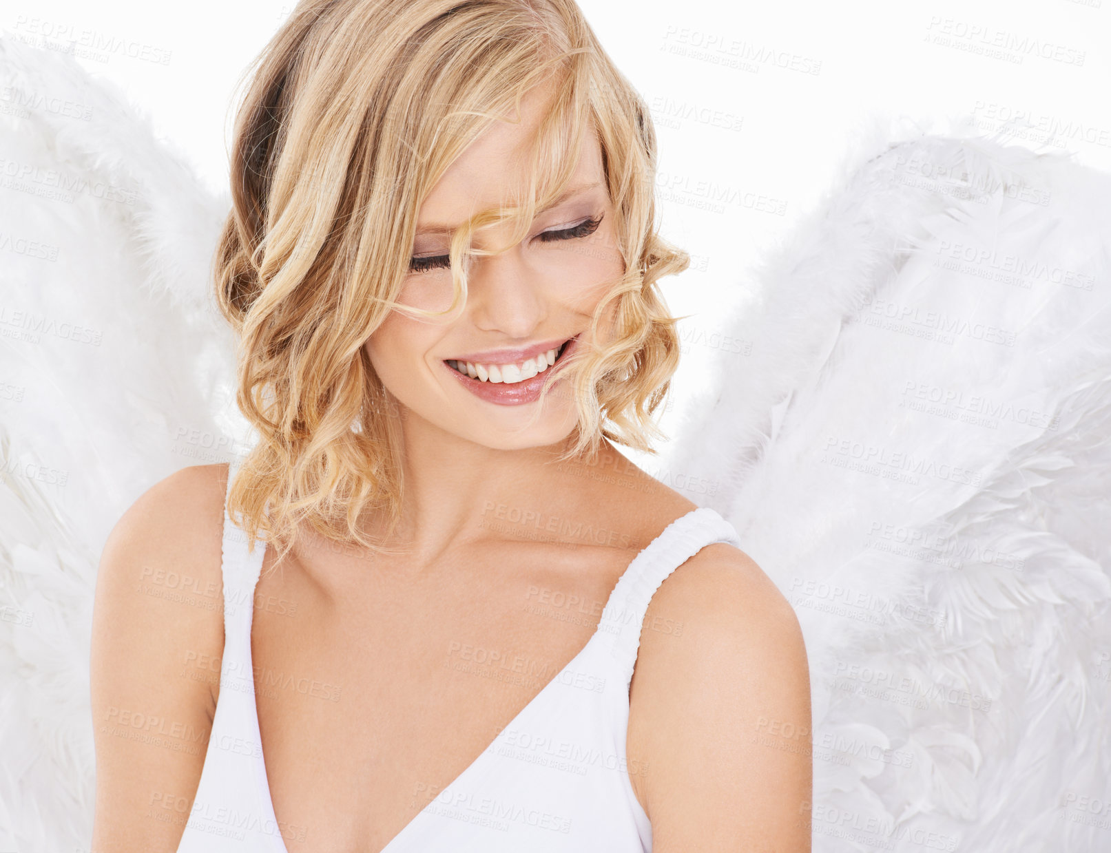 Buy stock photo Studio shot of a beautiful young woman wearing angel wings