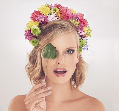 Buy stock photo Woman, portrait and surprised with flowers on crown in studio with makeup and leaf for cosmetics and skincare. Spring aesthetic, model and face or shocked with floral headband on white background