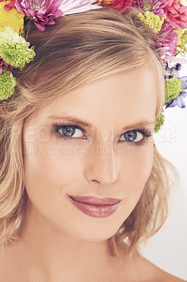 Buy stock photo Woman, portrait and flowers on crown in studio with makeup, smile and confidence for cosmetics and beauty. Spring aesthetic, model and floral headband with skincare and wellness on white background