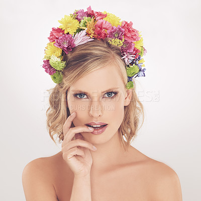 Buy stock photo Woman, portrait and flowers on crown in studio with makeup and confidence for cosmetics, beauty and skincare. Spring aesthetic, model and face or floral headband with wellness on white background