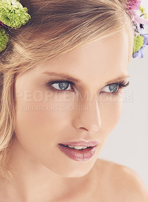 Buy stock photo Woman, face and flowers on crown in studio with makeup and confidence for cosmetics, beauty and skincare. Spring aesthetic, model and floral headband with glowing skin or wellness on white background