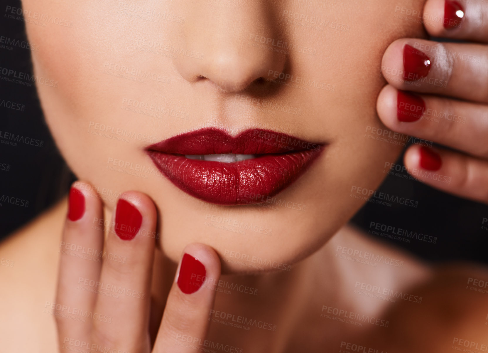 Buy stock photo Beauty, cosmetics and mouth of woman with manicure, studio and lipstick with creative aesthetic. Luxury makeup, face and hands with red nail polish for self care, shine and model on black background