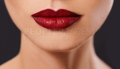 Buy stock photo Closeup, woman and red lipstick for beauty and cosmetics, skin and glow with bold color on black background. Cosmetology, mouth and makeup with face, cropped and luxury with glamour in studio