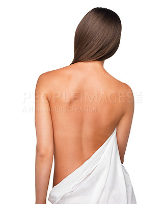 Buy stock photo Rearview shot of a beautiful young woman wrapped in a blanket