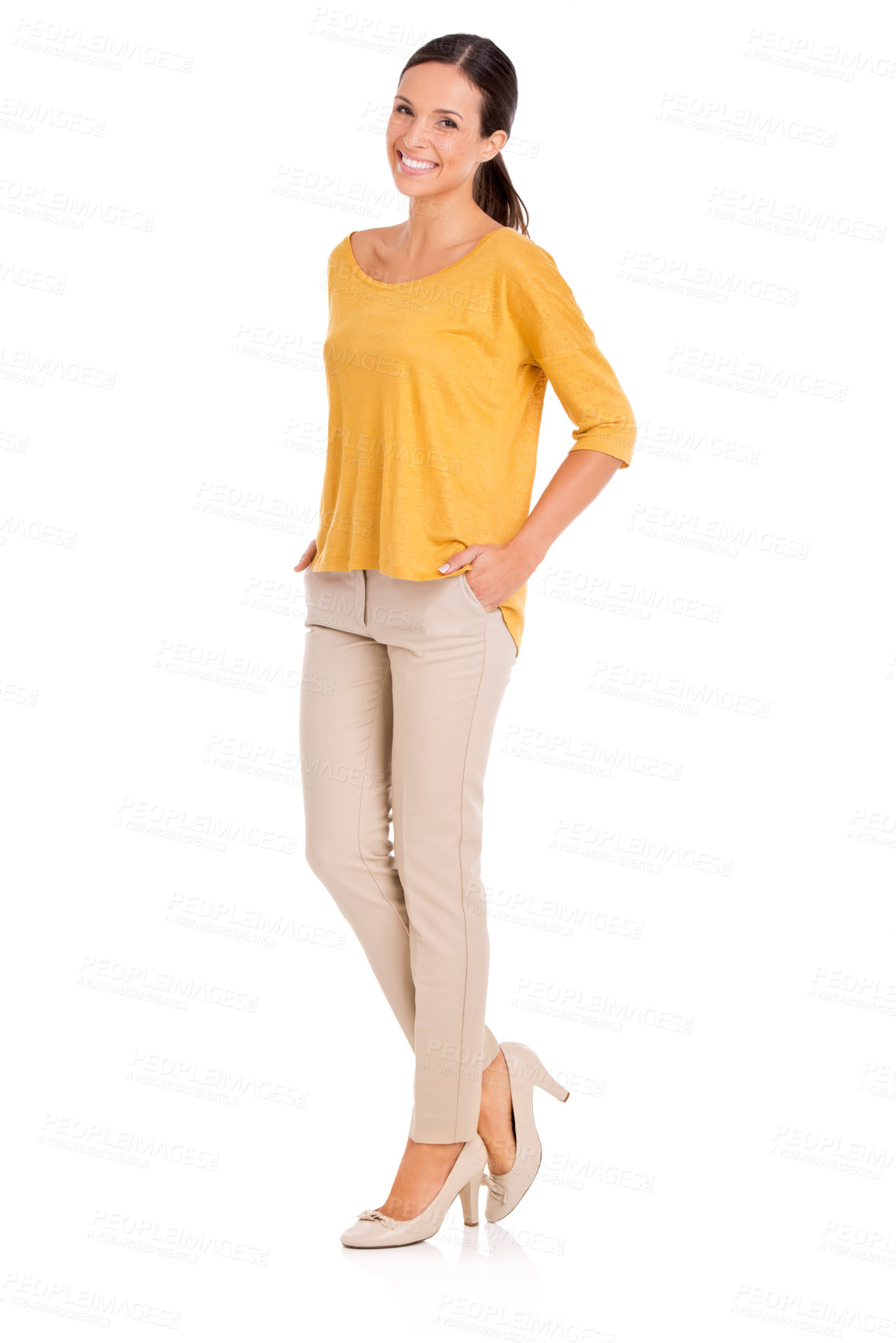 Buy stock photo A casually dressed young woman standing with her hands in her pockets