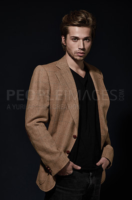 Buy stock photo Fashion, handsome and portrait of a man in studio with fancy, trendy and stylish winter outfit. Confidence, attractive and young serious male model with classy style isolated by dark black background