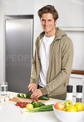 Buy stock photo Diet, cooking and man cutting vegetables on kitchen counter with salad, wellness and nutrition in home. Wood board, knife and healthy food process with brunch, chef and vegan meal prep in apartment