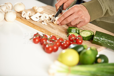 Buy stock photo Diet, cooking and hands cutting vegetables on kitchen counter with salad, wellness and nutrition in home. Wood board, knife and healthy food process with brunch, chef and vegan meal prep in apartment