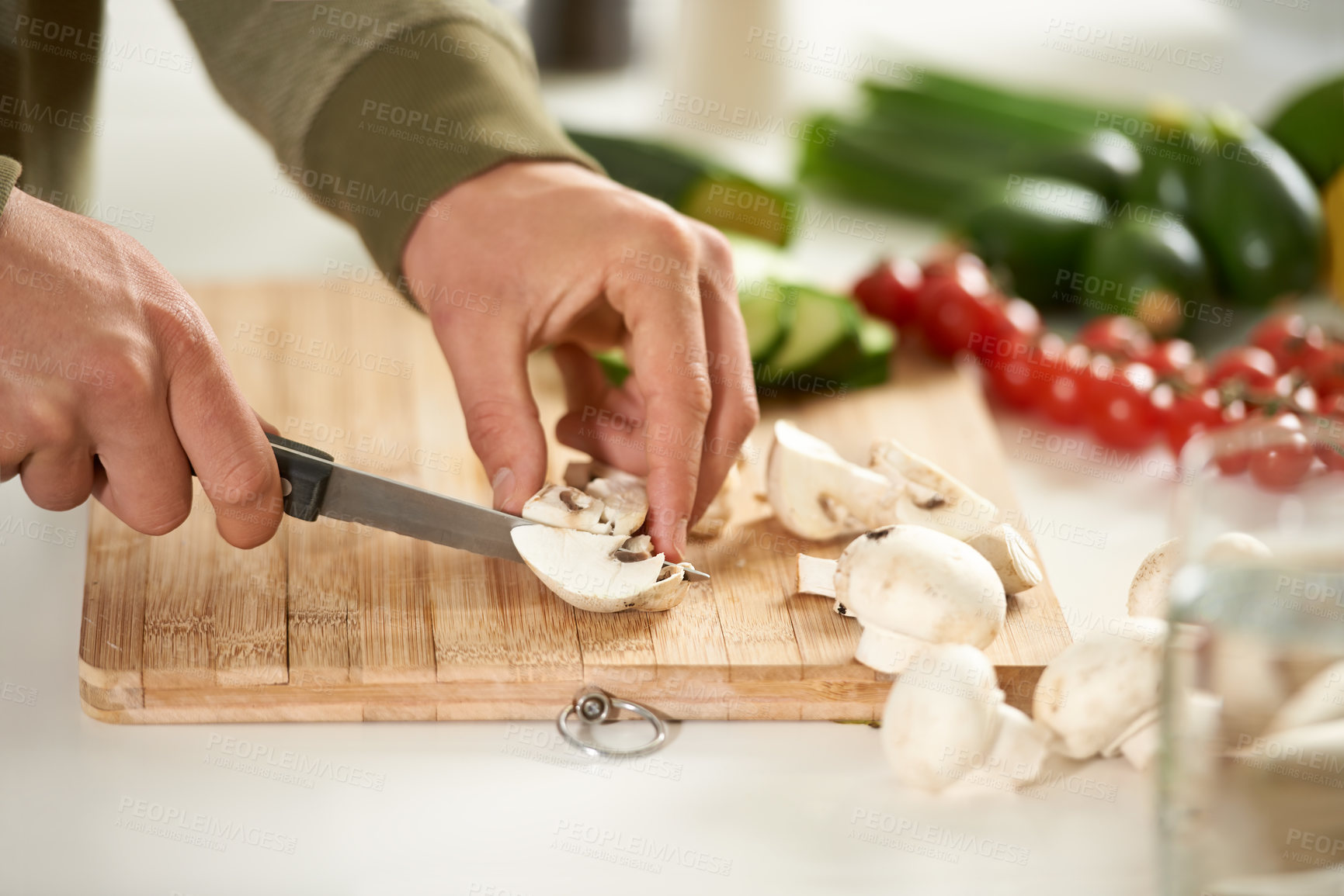 Buy stock photo Vegetables, cooking and hands cutting mushroom on kitchen counter with salad, wellness and nutrition in home. Wood board, knife and healthy food with brunch, chef and vegan meal prep in apartment