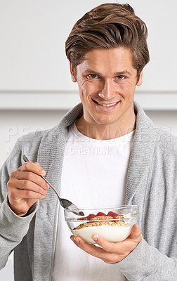 Buy stock photo Smile, portrait and man with cereal in kitchen of home for hydration, health and wellness. Happy, confident and young male person eating breakfast with fruit, yoghurt and muesli in modern apartment.