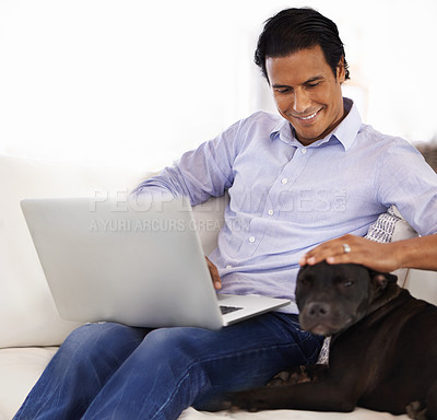 Buy stock photo Man, dog and face with laptop on sofa for bonding, playing or happiness with remote work in home. Animal, person and cuddle with smile on couch in living room for research, comfort and love for puppy